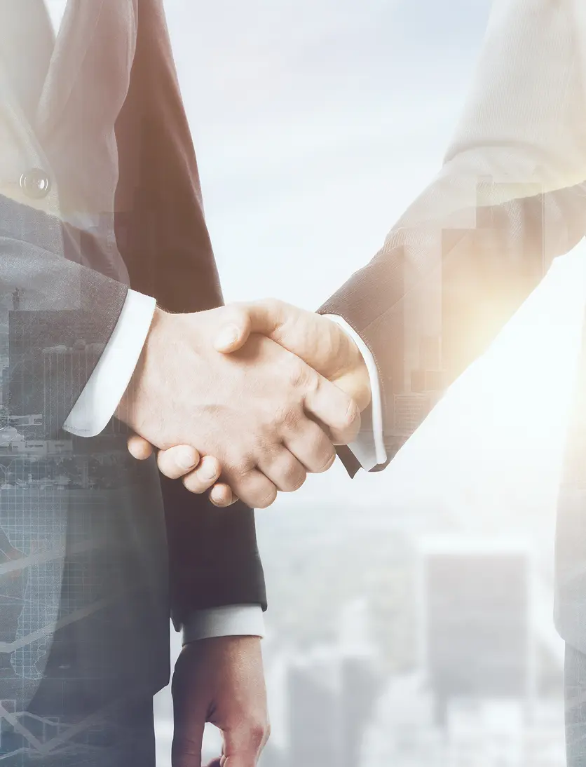 AppleTech team shaking hands with a client in a software development partnership
